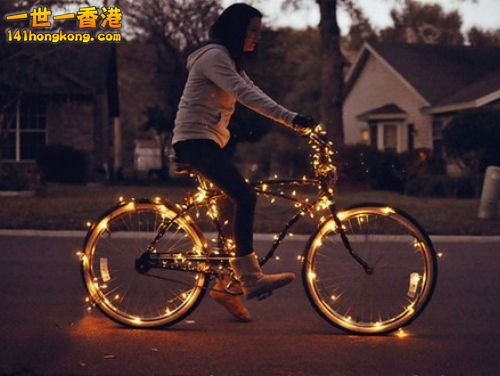 Girl-on-bicycle-with-lights.jpg