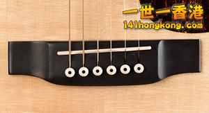 Acoustic_guitar_bridge.jpg