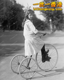155962604_victorian-girl-on-antique-tricycle-reprint-photo.jpg