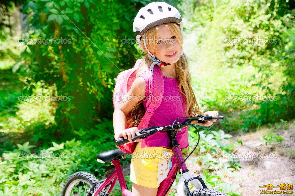 depositphotos_6214276-Children-girl-riding-bicycle-outdoor-in-forest-smiling.jpg