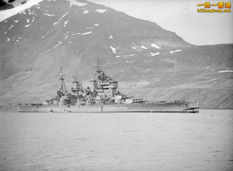 HMS King George V, photographed with a huge hole in her bows, after the battlesh.jpg