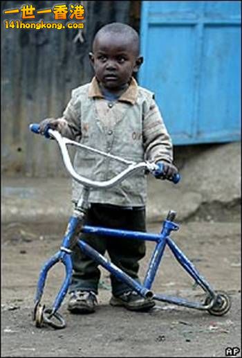 poor-child-bicycle-africa-slum_1.jpg