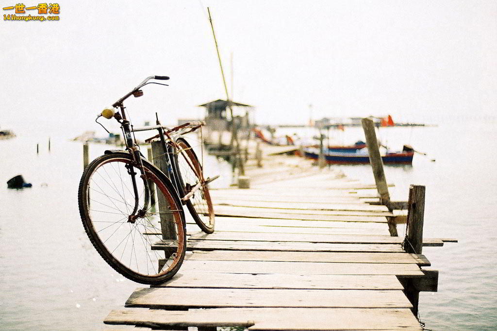 Bicycle-on-the-pier,-Penang,-Malaysia.jpg
