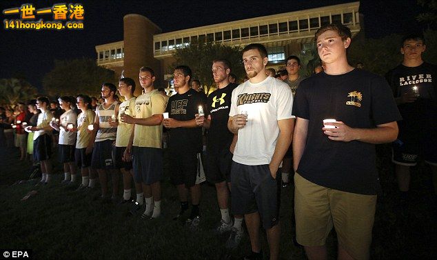 Hundreds of students at the University of Central Florida held lit candles.jpg