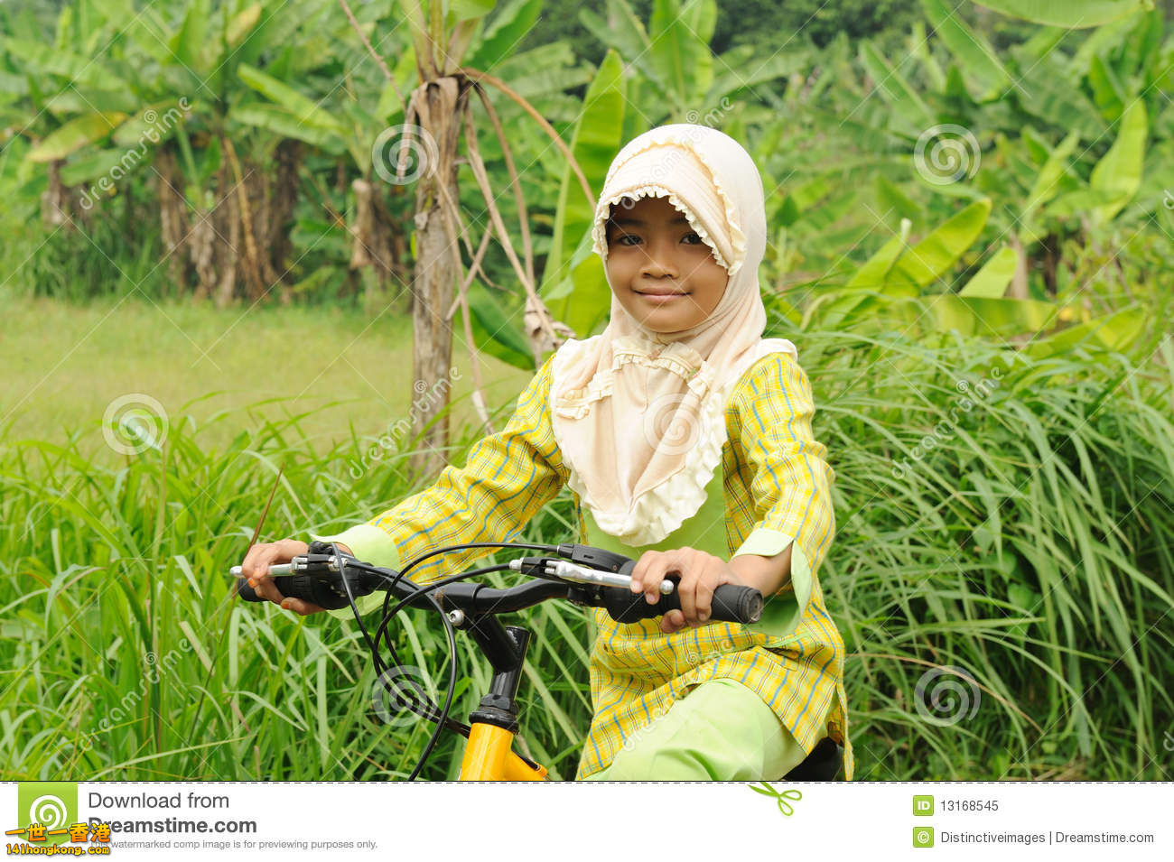 muslim-girl-riding-bicycle-13168545.jpg
