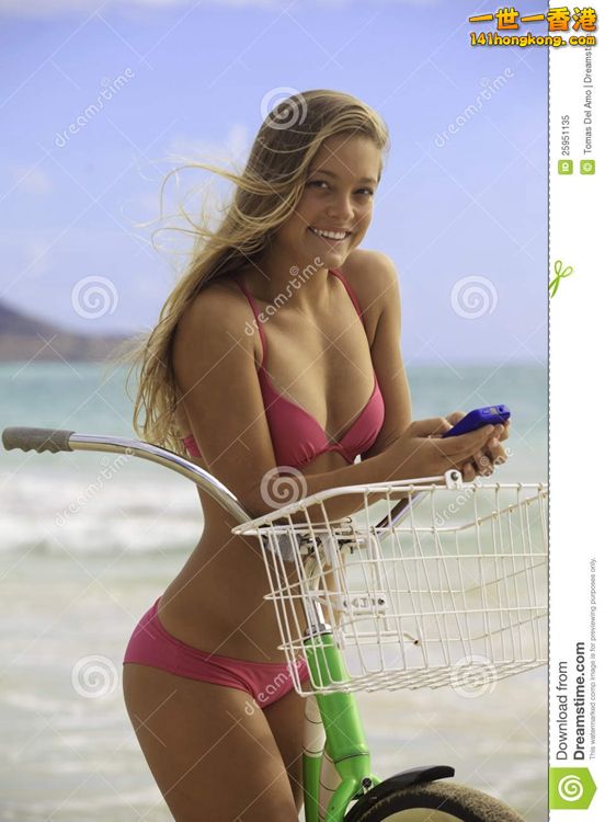 girl-bike-beach-texting-25951135.jpg