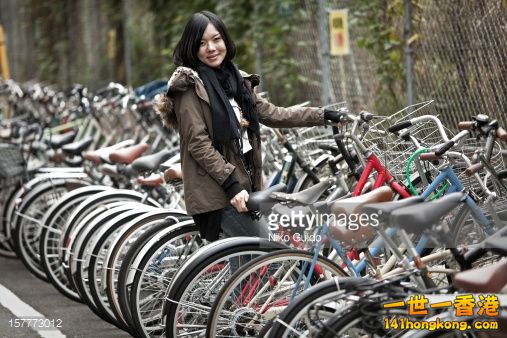 157773012-young-japanese-girl-at-bicycle-park-gettyimages.jpg