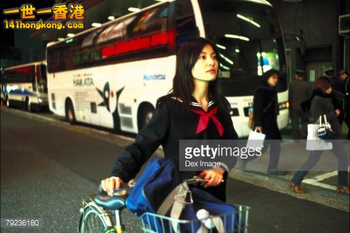 79236180-school-girl-pushing-a-bicycle-gettyimages.jpg