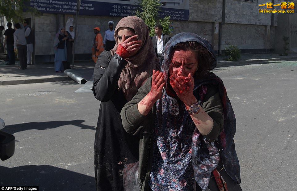 40F4115300000578-4557562-Wounded_Afghan_women_were_seen_running_from_the_scene_o.jpg