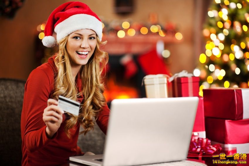___girl_christmas_shopping_online_with_credit_card_iStock_000021878112Small.jpg