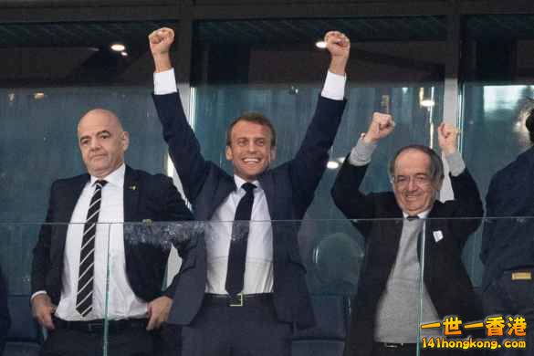 Emmanuel-Macron-Pamela-Anderson-and-millions-in-Paris-celebrate-France-winning-W.jpg
