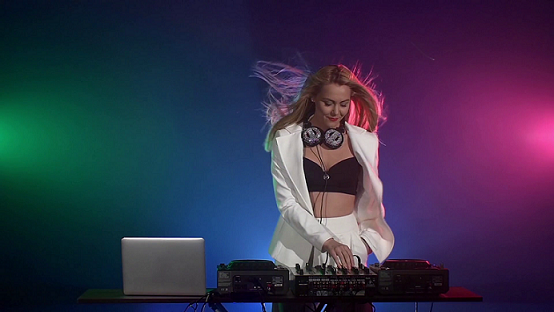 beautiful-smiling-sexy-dj-girl-in-white-jacket-headphones-playing-music-and-danci.png