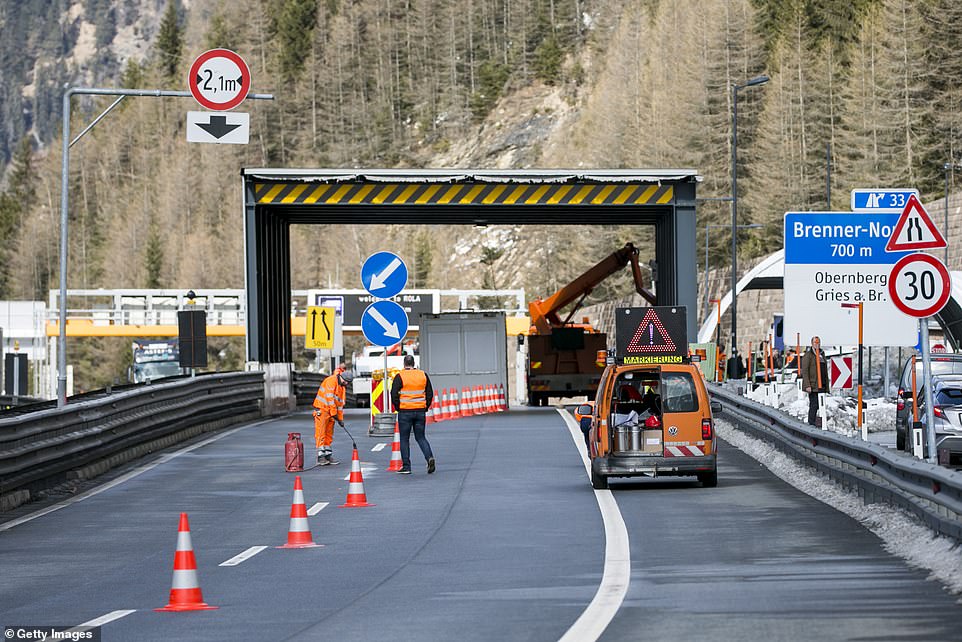 A roadblock is shown at the Austrian border.jpg