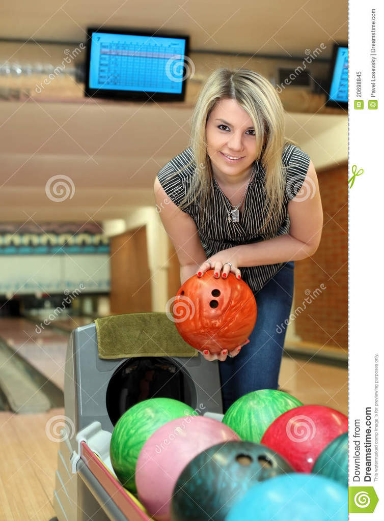 girl-takes-two-hands-ball-playing-bowling-20698845.jpg