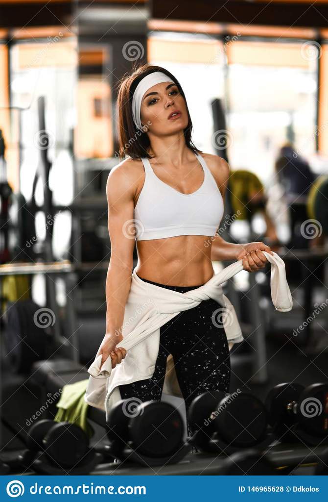 athletic-girl-standing-training-gym-near-mirror-knotting-sports-jacket-hips-woma.jpg