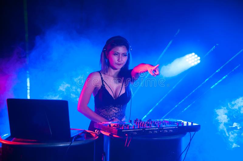 pretty-asian-female-woman-dj-playing-music-dance-night-101681163.jpg