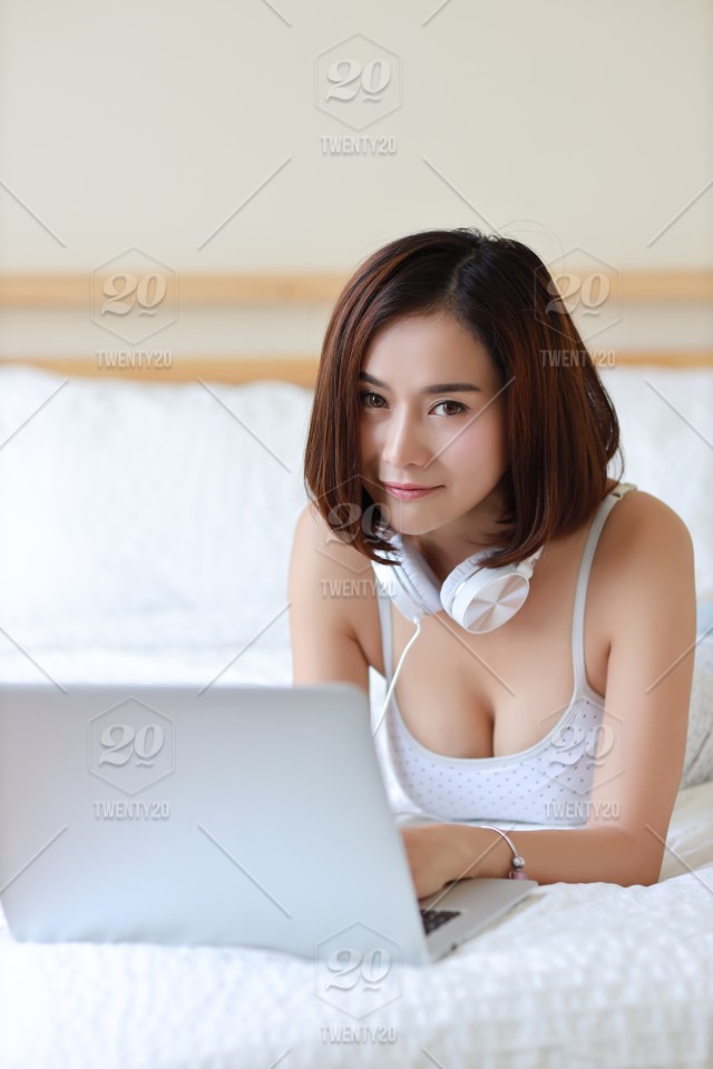 stock-photo-business-bed-bedroom-lifestyle-computer-attractive-young-female-asia.jpg