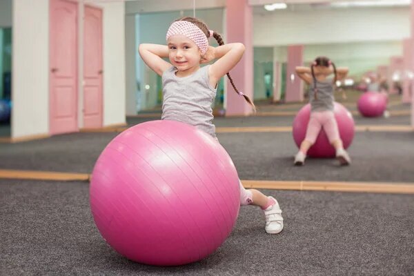 depositphotos_156217118-stock-photo-girl-child-doing-fitness-exercises.jpg