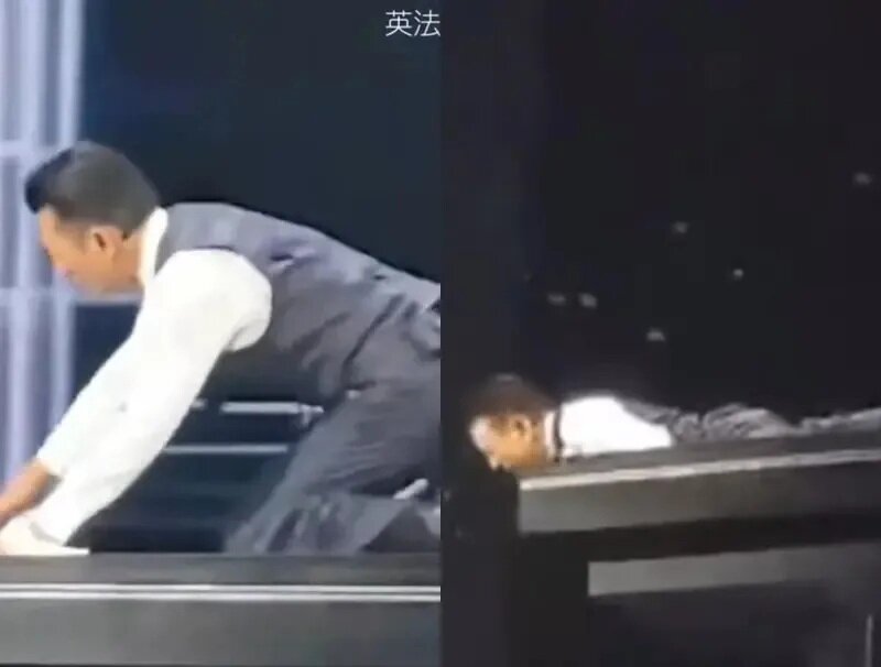 2 劉德華滑跪到一半突變成撲倒，在舞台上慘摔，頭部超出舞台邊緣。.jpg