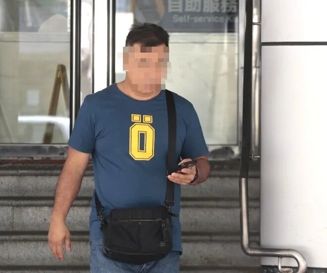 涉襲東網記者惡漢今報到 完成手續後頭耷耷.jpg