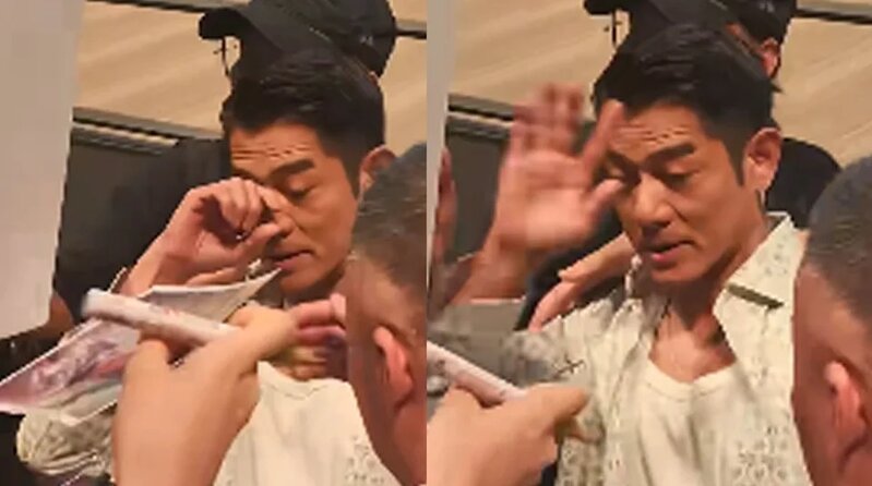 2 郭富城伸手揉了一下眼睛，隨即皺眉舉手示意。（小紅書影片截圖）.jpg