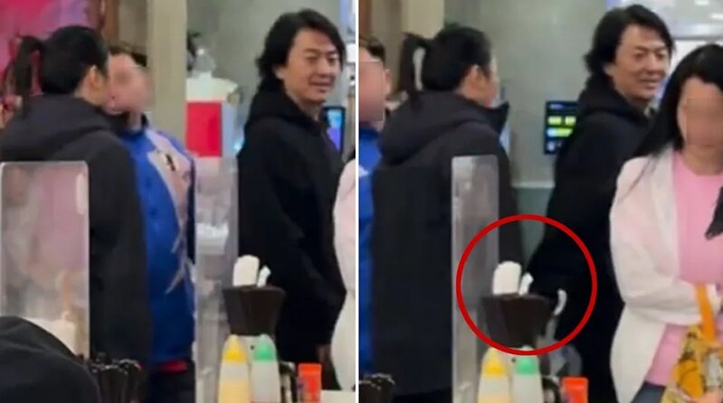 2 臨近走到座位前，伊健很自然地回頭望向太太，更伸手輕輕相扶（紅圈示），相信是方便.jpg