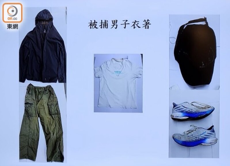 警員展示被捕人士犯案時所穿服飾。(吳鎮興攝).jpg