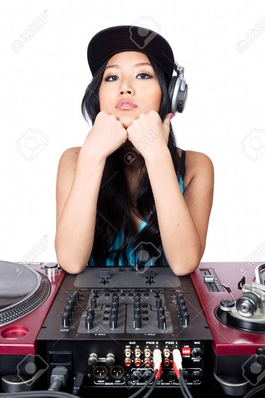 10983561-a-young-female-asian-dj-posing-for-a-photo-in-front-of-her-gear.jpg